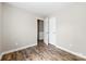 Bedroom featuring wood flooring, a neutral color scheme, and access to storage space at 1682 Sandpiper Dr, Rock Hill, SC 29732