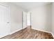 Clean and well-lit bedroom with wood floors and closet, offering a comfortable and functional living space at 1682 Sandpiper Dr, Rock Hill, SC 29732