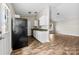 Well-lit kitchen with white cabinets, granite counters, and modern appliances creates a functional and stylish cooking space at 1682 Sandpiper Dr, Rock Hill, SC 29732