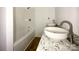 Bright bathroom featuring a modern vanity with granite countertop and a bathtub with a white surround at 171 Three Cs Rd, Kershaw, SC 29067