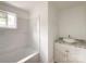 Bathroom showcasing a bathtub with a window, a new countertop, and a newly installed shower at 171 Three Cs Rd, Kershaw, SC 29067