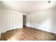 Bedroom featuring neutral walls, wood flooring, and closet at 171 Three Cs Rd, Kershaw, SC 29067