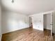 Bright room with wood floors and white walls, featuring multiple doors and ample space at 171 Three Cs Rd, Kershaw, SC 29067
