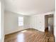 Bright bedroom with wood flooring, closet, and neutral paint at 171 Three Cs Rd, Kershaw, SC 29067
