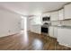 Modern kitchen with white cabinets, stone countertops, and stainless steel appliances in an open space at 171 Three Cs Rd, Kershaw, SC 29067