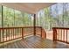 View of the covered porch overlooks the wooded backyard at 176 Forest Creek Dr, Statesville, NC 28625