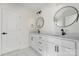 Bathroom features double sinks, modern black hardware, and a white marble floor at 176 Forest Creek Dr, Statesville, NC 28625