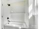 Bright bathroom showcasing a sleek, tiled shower and bath combo with modern fixtures at 176 Forest Creek Dr, Statesville, NC 28625