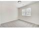 Bright bedroom with a large window and woodside view at 176 Forest Creek Dr, Statesville, NC 28625