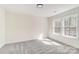 Bright bedroom with neutral decor, plush carpet, two windows offering natural light, and recessed lighting at 176 Forest Creek Dr, Statesville, NC 28625