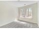 Bright bedroom with a large window featuring a wooded view at 176 Forest Creek Dr, Statesville, NC 28625