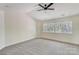 A spacious bedroom with a ceiling fan, light walls, carpeted floor, and a large double window at 176 Forest Creek Dr, Statesville, NC 28625