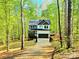 Charming, modern two-story home with a two-car garage nestled among lush trees in a serene, wooded setting at 176 Forest Creek Dr, Statesville, NC 28625