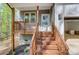 The front porch of the home features wooden stairs and railings at 176 Forest Creek Dr, Statesville, NC 28625