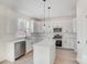 The kitchen features stainless steel appliances and an island at 176 Forest Creek Dr, Statesville, NC 28625