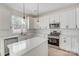 The kitchen features stainless steel appliances and an island at 176 Forest Creek Dr, Statesville, NC 28625