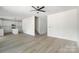 Living room with hardwood floors leads into kitchen at 176 Forest Creek Dr, Statesville, NC 28625