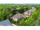 Aerial view of an upscale home surrounded by lush trees in a desirable neighborhood at 18618 Rollingdale Ln, Davidson, NC 28036