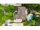 Aerial view of the property showcasing a large backyard with a pool, patio, and manicured lawn at 18618 Rollingdale Ln, Davidson, NC 28036