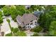 Aerial view of a stunning home with a well-manicured lawn, garden, and outdoor patio at 18618 Rollingdale Ln, Davidson, NC 28036