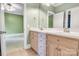 Ensuite bathroom with double vanity sinks and large mirrors, conveniently located off the bedroom at 18618 Rollingdale Ln, Davidson, NC 28036