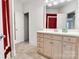 Bright bathroom featuring a vanity with white countertops and a mirror with vanity lighting at 18618 Rollingdale Ln, Davidson, NC 28036