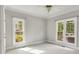 Spacious bedroom with abundant natural light from two large windows at 18618 Rollingdale Ln, Davidson, NC 28036