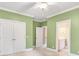 Spacious bedroom with ensuite bathroom, double closet doors and neutral color scheme at 18618 Rollingdale Ln, Davidson, NC 28036
