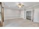 Bonus room with crown molding and adjacent staircase, plenty of natural light at 18618 Rollingdale Ln, Davidson, NC 28036