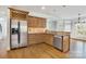 Well-appointed kitchen featuring stainless steel appliances, custom cabinetry, and an adjacent breakfast nook at 18618 Rollingdale Ln, Davidson, NC 28036