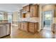 Beautiful kitchen with custom wood cabinetry, tile backsplash, granite countertops, and stainless steel appliances at 18618 Rollingdale Ln, Davidson, NC 28036