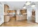 Bright kitchen features custom cabinetry, hardwood floors, stainless appliances, and a seamless flow into the living area at 18618 Rollingdale Ln, Davidson, NC 28036