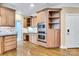 Kitchen with stainless steel appliances, granite countertops, built-in oven, custom cabinets, and hardwood flooring at 18618 Rollingdale Ln, Davidson, NC 28036