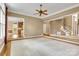 Open living room with hardwood floors and view of staircase and adjacent kitchen at 18618 Rollingdale Ln, Davidson, NC 28036