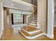 Open-concept design with a staircase and large windows that fill the space with natural light at 18618 Rollingdale Ln, Davidson, NC 28036
