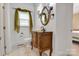 Elegant powder room featuring a decorative vanity with a mirror and sconces at 18618 Rollingdale Ln, Davidson, NC 28036