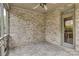 Spacious screened porch with stone-style brickwork and access to the outdoor area at 18618 Rollingdale Ln, Davidson, NC 28036