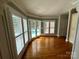 Bright bonus room with hardwood floors and views of the backyard pool through shuttered windows at 1901 Benjamin Dr, Salisbury, NC 28146