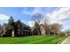 Beautiful brick home with mature trees and a meticulously striped lawn on a sunny day at 1901 Benjamin Dr, Salisbury, NC 28146