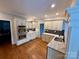 Bright kitchen with stainless steel appliances, double wall oven, granite counters and light wood floor at 1901 Benjamin Dr, Salisbury, NC 28146