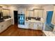 Spacious kitchen featuring stainless steel appliances, double wall oven, granite countertops, and hardwood floors at 1901 Benjamin Dr, Salisbury, NC 28146