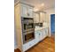 A sleek kitchen features granite counters, stainless steel double oven and light colored cabinetry at 1901 Benjamin Dr, Salisbury, NC 28146