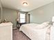 Simple bedroom setup featuring a bed, desk, and neutral decor at 20025 Metaphor Mews None, Davidson, NC 28036