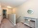 Hallway with carpet, decor table and mirror at the top of the stairs at 20025 Metaphor Mews None, Davidson, NC 28036