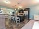 Modern kitchen featuring a large island with bar seating, stainless steel appliances and hardwood floors at 20025 Metaphor Mews None, Davidson, NC 28036