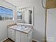 Well-lit bathroom featuring a double sink vanity, tile accent wall, and updated fixtures, perfect for modern living at 2035 Mauney Rd, Bessemer City, NC 28016