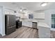 Bright kitchen featuring ample white cabinetry and stainless steel appliances at 2035 Mauney Rd, Bessemer City, NC 28016