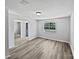 Bright living room showcasing new floors, freshly painted walls, and a large window offering pleasant views at 2035 Mauney Rd, Bessemer City, NC 28016