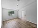 Spacious living room features abundant natural light with new floors and neutral wall color creating a welcoming ambiance at 2035 Mauney Rd, Bessemer City, NC 28016