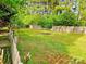 Large backyard with a wooden fence providing privacy at 213 Meadow Wind Ct, Monroe, NC 28110